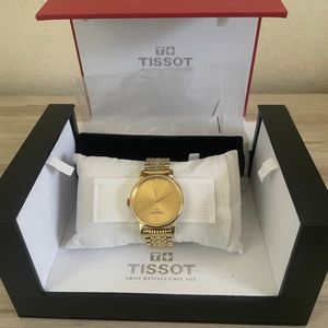 Gold Tissot Watcg